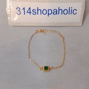 Gold Bracelet With Green Gemstone